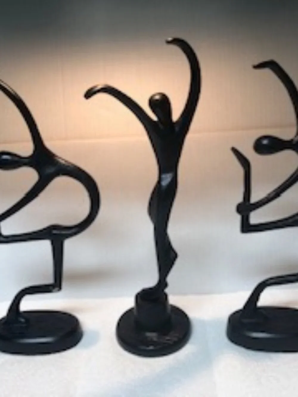 Three dancers female cast metal sculptures designed by Bodrul Khalique for IKEA